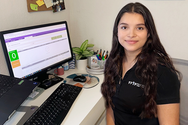 Andrea Delgado works at her home office