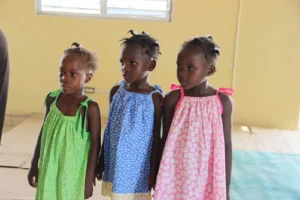 Wearing their new dresses