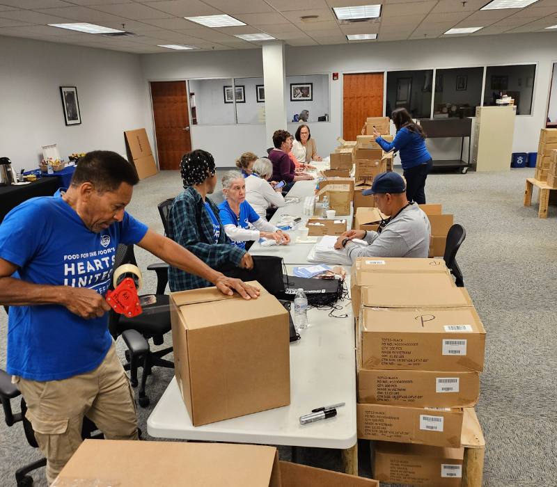 FFTP volunteers pack boxes full of hygiene kits